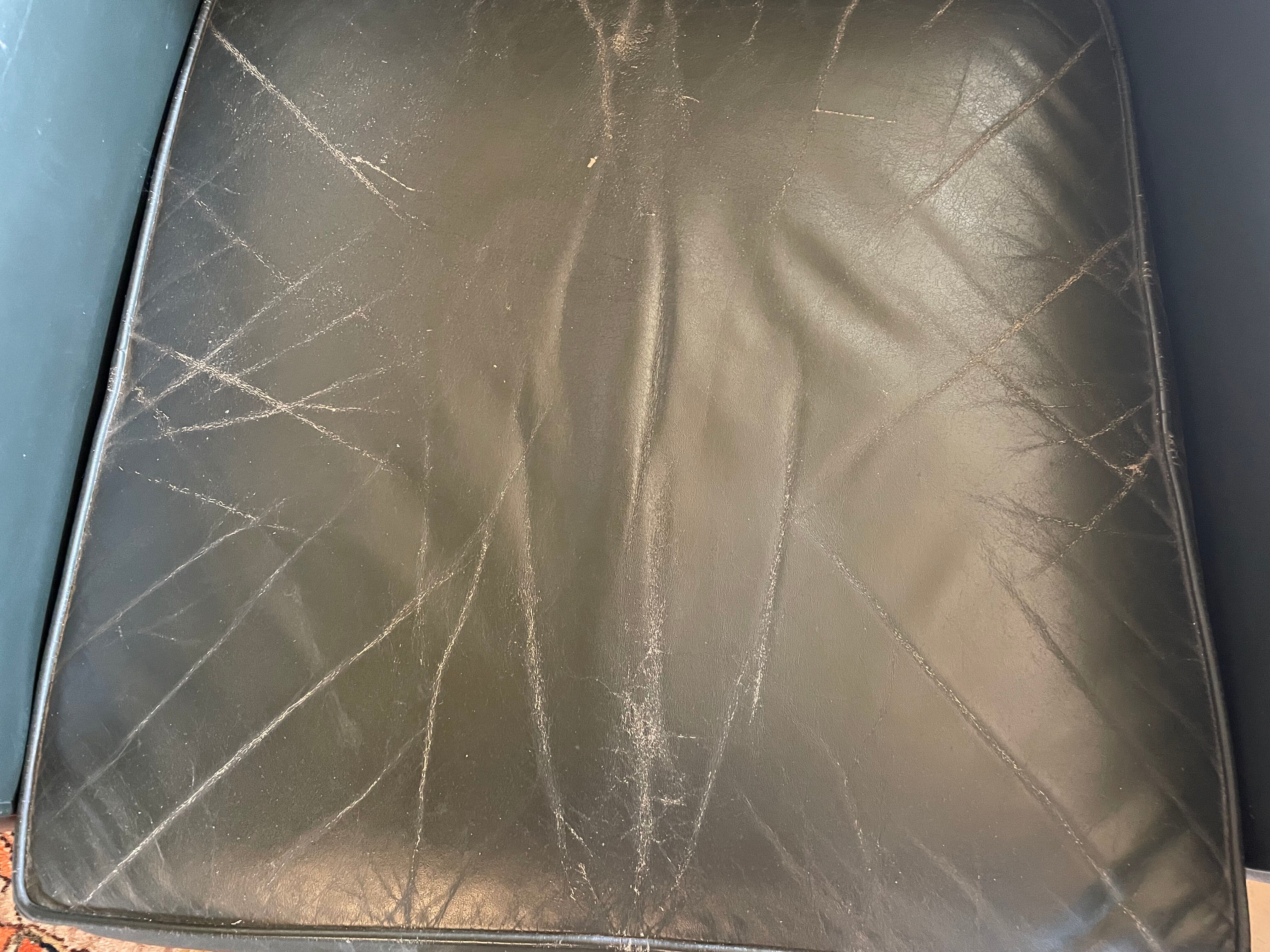 Green leather club chairs