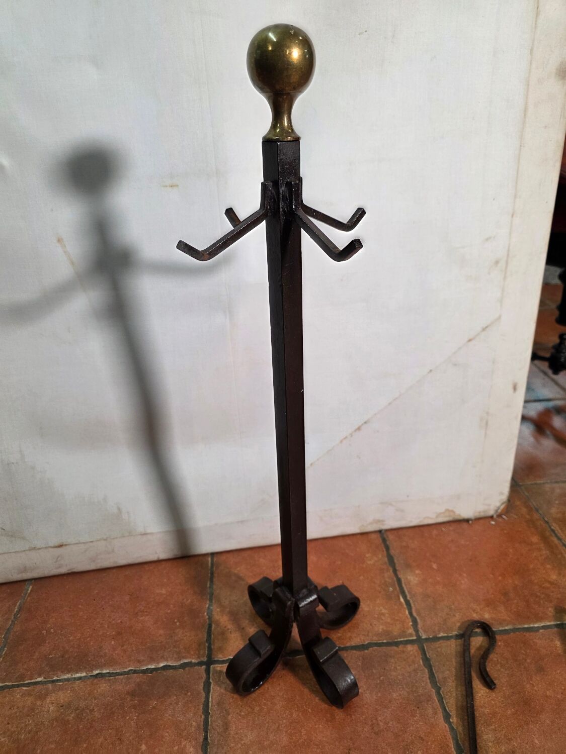 Antique fireplace set in solid wrought iron and brass.