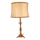 bronze candlestick from the 17th century converted into a lamp with its lampshade