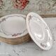Lot de 12 assiettes creuses l'amandinoise frise dorure et roses anciennes. en demi-porcelaine poreyl