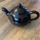 Brown ceramic teapot