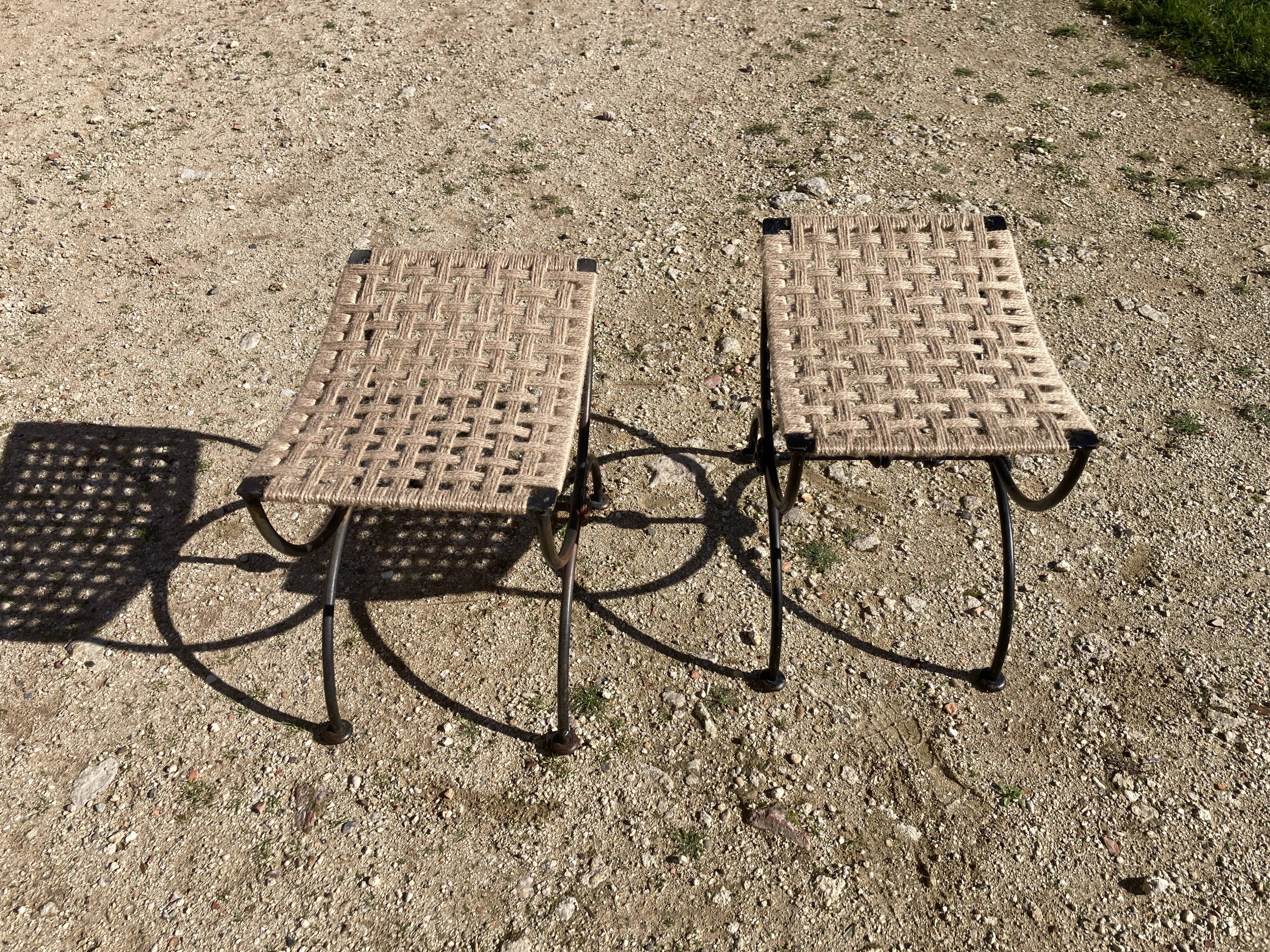 Pair of curule stools In wrought iron. Woven seat