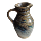 Enamelled ceramic pitcher, signature mb the terminal