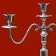 Pair of vintage three-armed chrome metal candlesticks