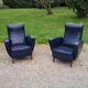 Paire de fauteuils des années 50 pieds compas recouverts de skaï bleu marine