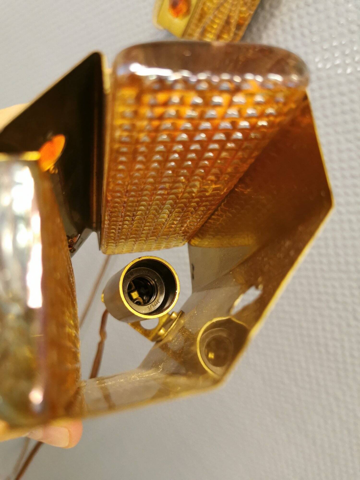 A pair of wall lights with brass-colored suspension with thick pressed glass. Vitrika, Denmark