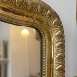 Miroir ancien de style Louis XVI, doré à la feuille