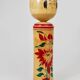 Decorative Naruko Kokeshi doll sculpture from northern Japan, hand-painted.