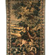 Tapestry decorated with a pink flamingo in a green landscape, woven by hand