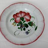 Old earthenware plate of the East Strasbourg decorated with flowers