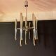 Scoliari chandelier with 18 bright nickel dots distributed by Boulanger