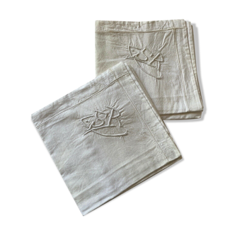 Pair of hand-embroidered SR monogram pillowcases.