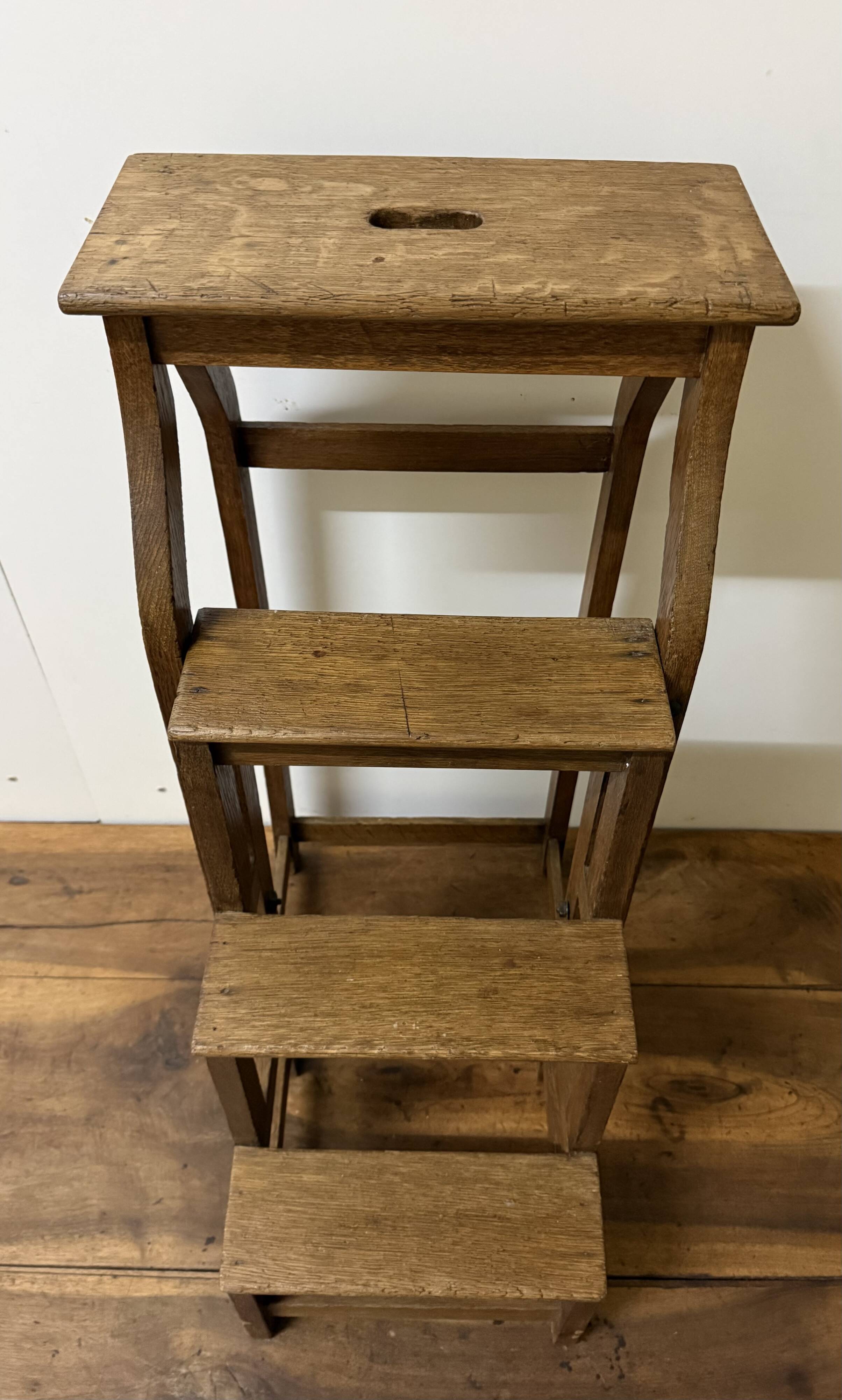 Stool transforming into a step ladder.