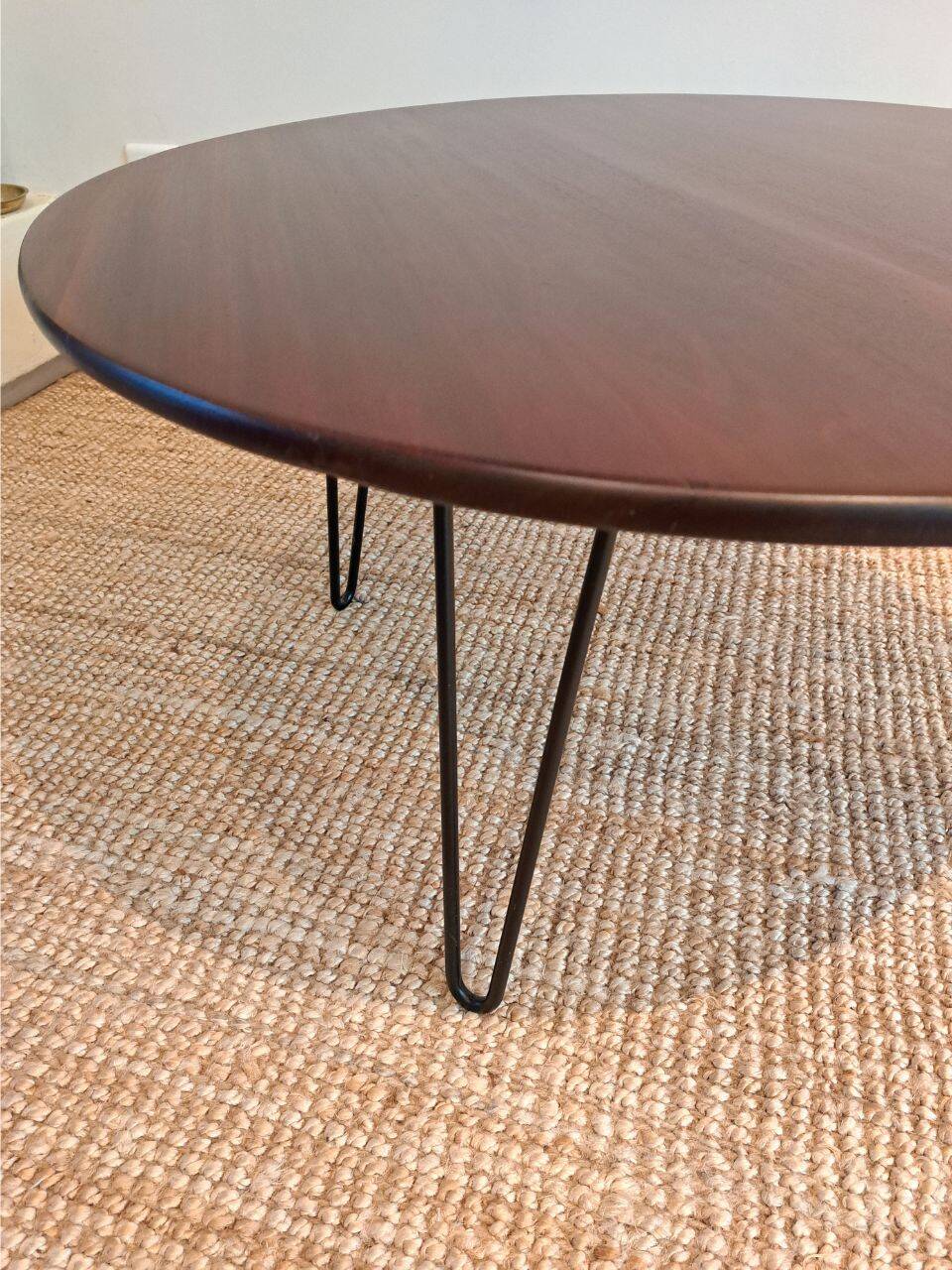 Round coffee table with mahogany wood top