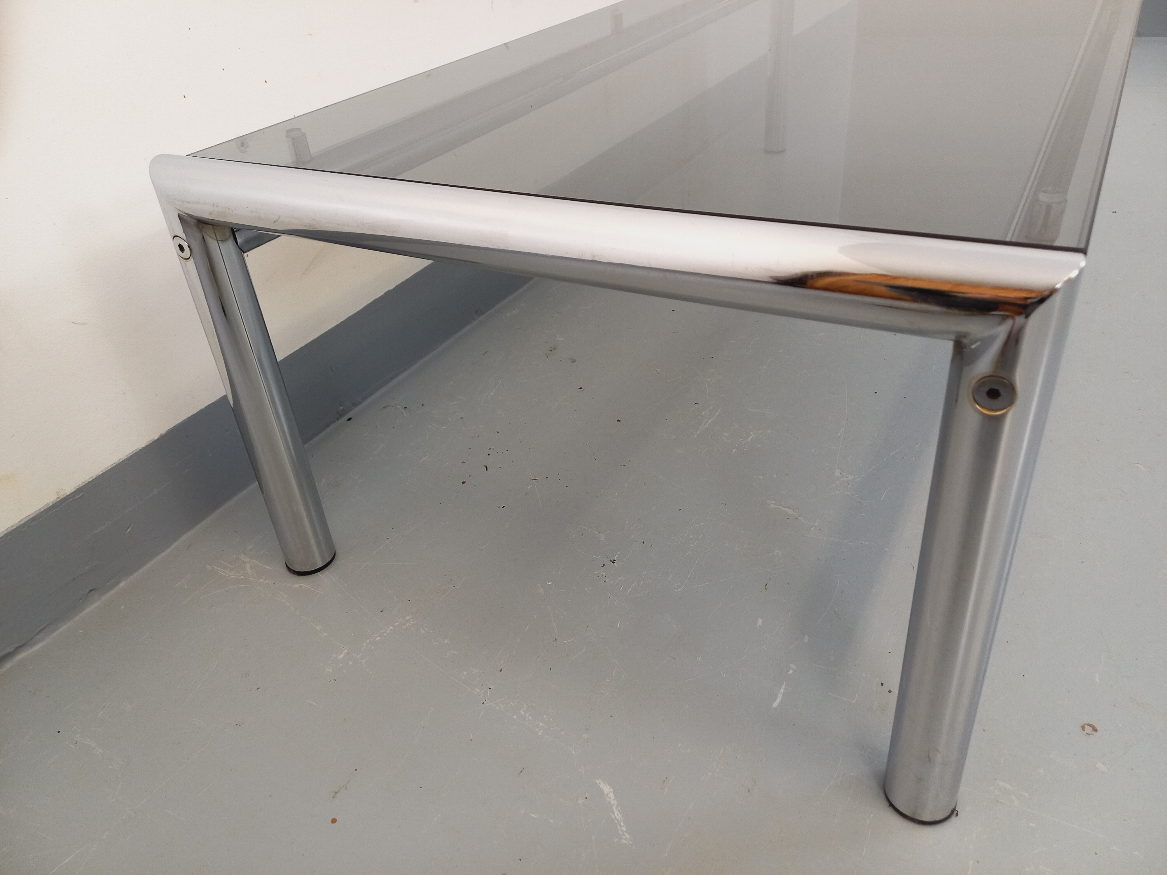 Vintage rectangular coffee table in smoked glass and chrome metal from the 1960s.
