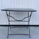 Folding riveted iron table