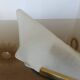 Art Deco wall light in brass and thick frosted glass.