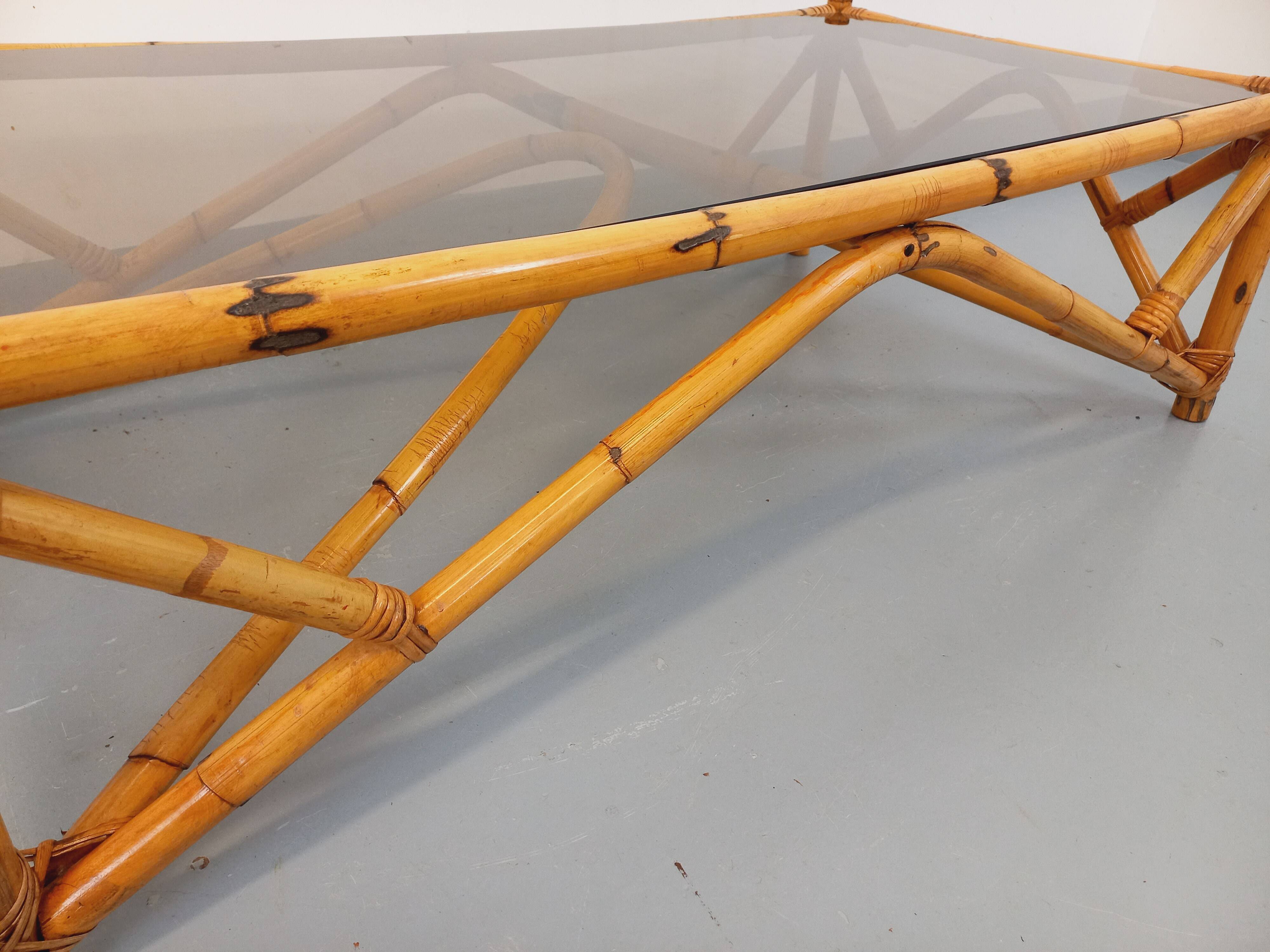 Vintage rectangular coffee table in rattan and smoked glass from the 1970s.