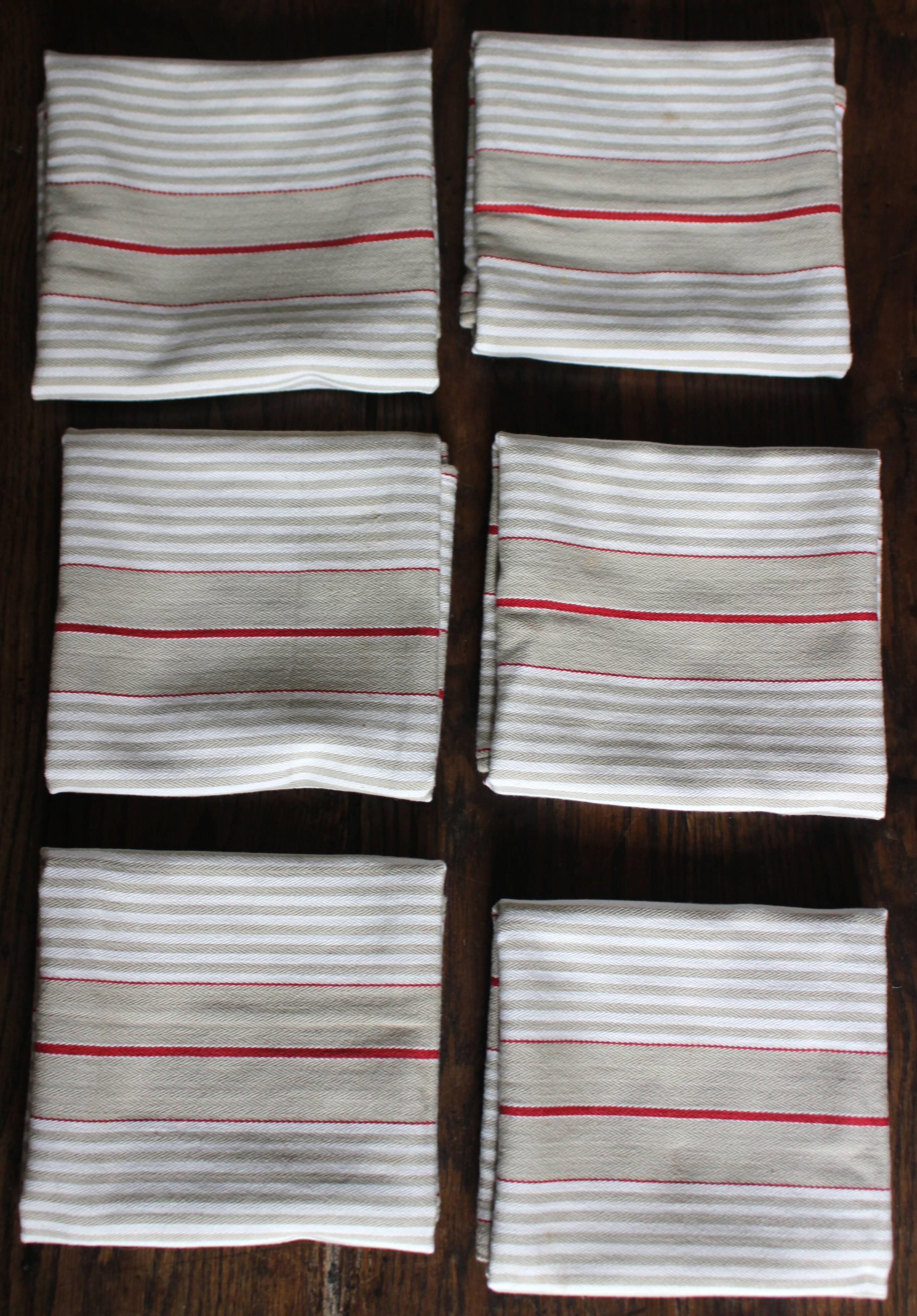 6 beige and red mattress cloth napkins