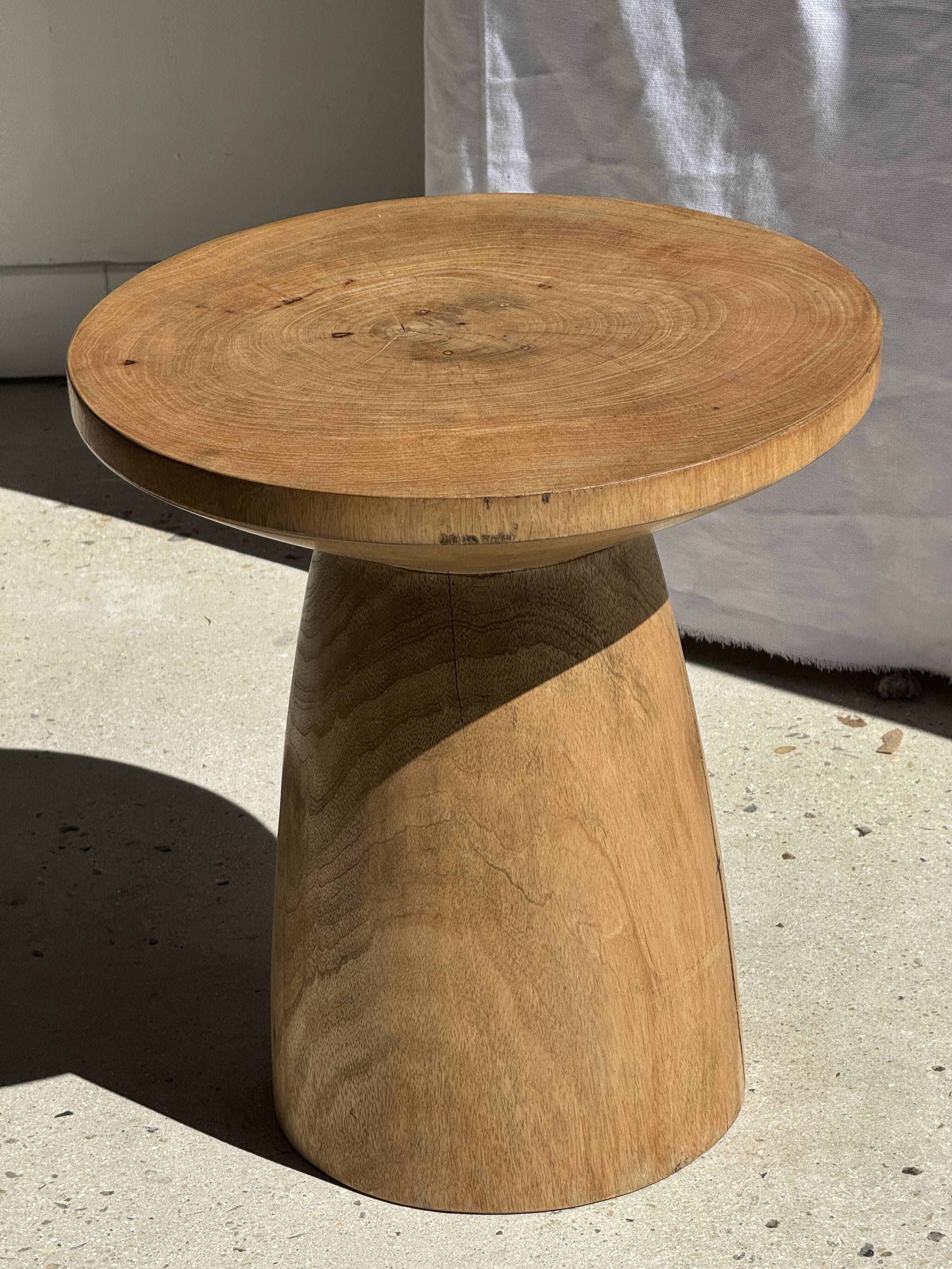 Natural solid mango side table (monoxyle) with conical legs.