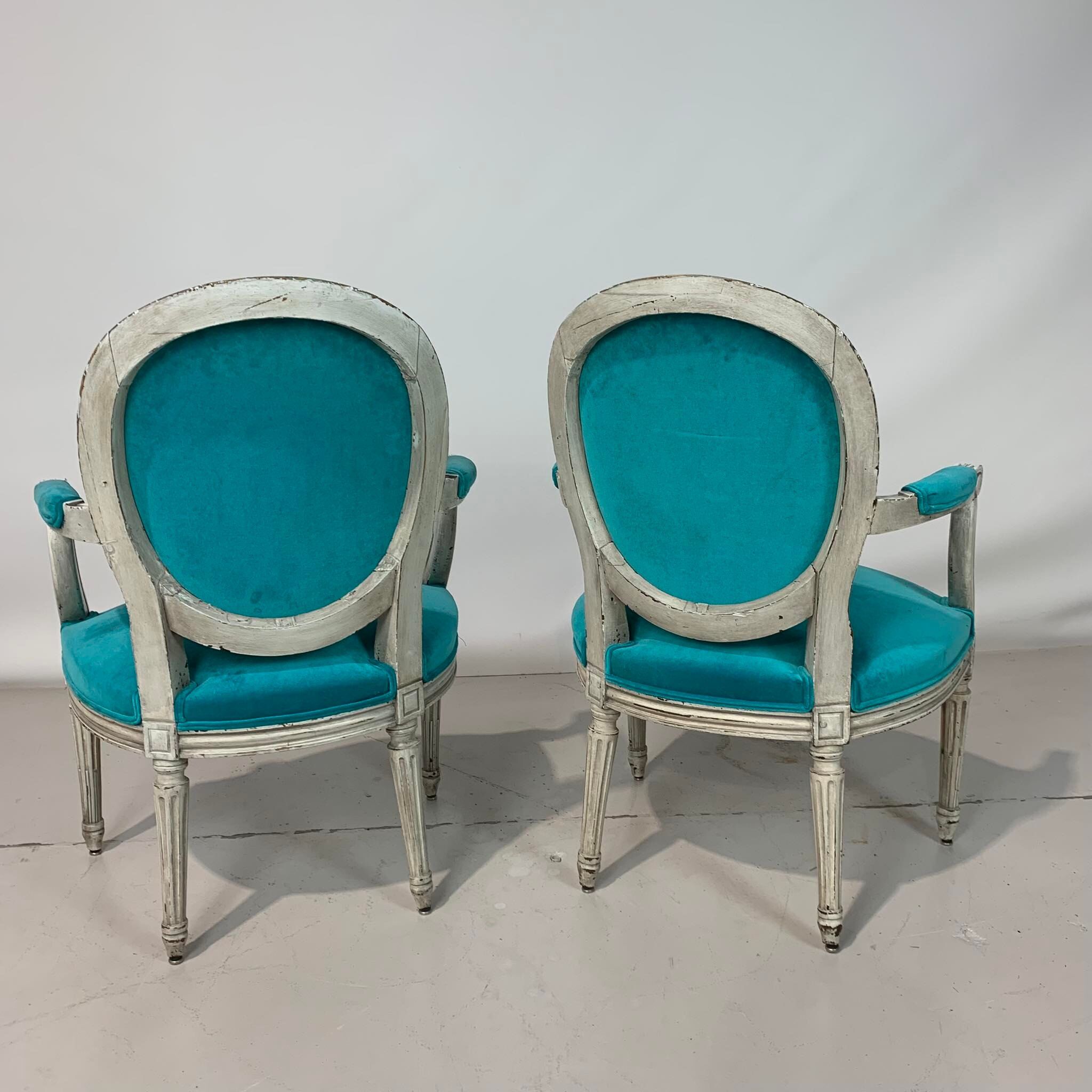 Pair of Louis XVI convertible armchairs