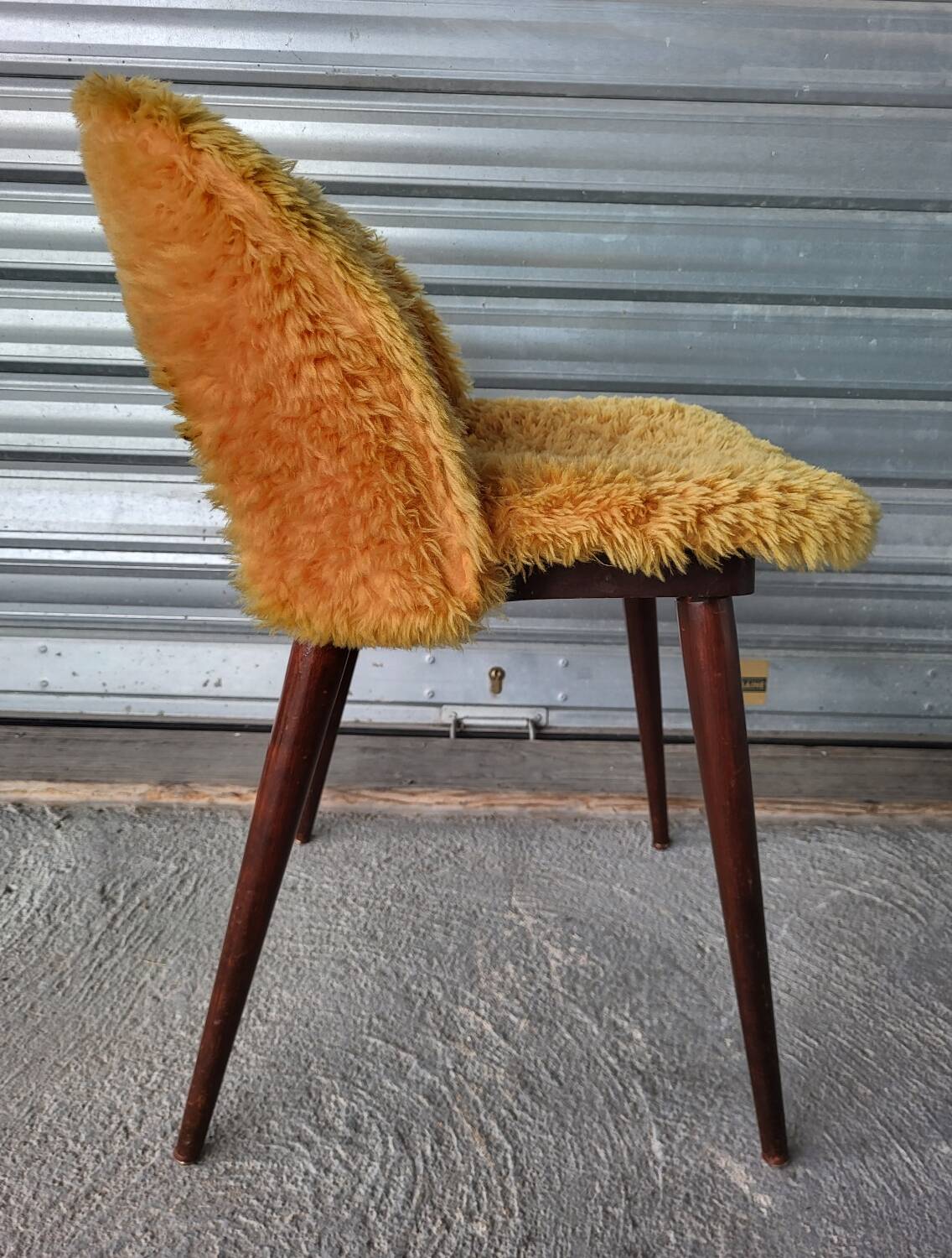 Authentic old vintage furry armchair in good condition