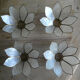 Brass chandelier and flowers in mother-of-pearl petals