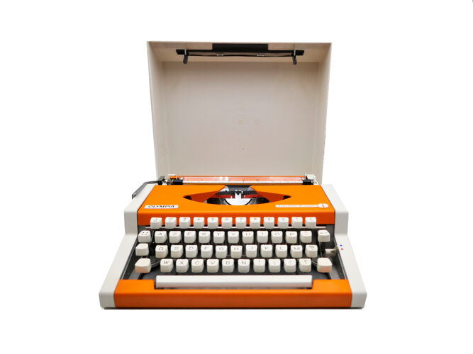 Machine à écrire Olympia traveller de luxe orange révisé et ruban neuf