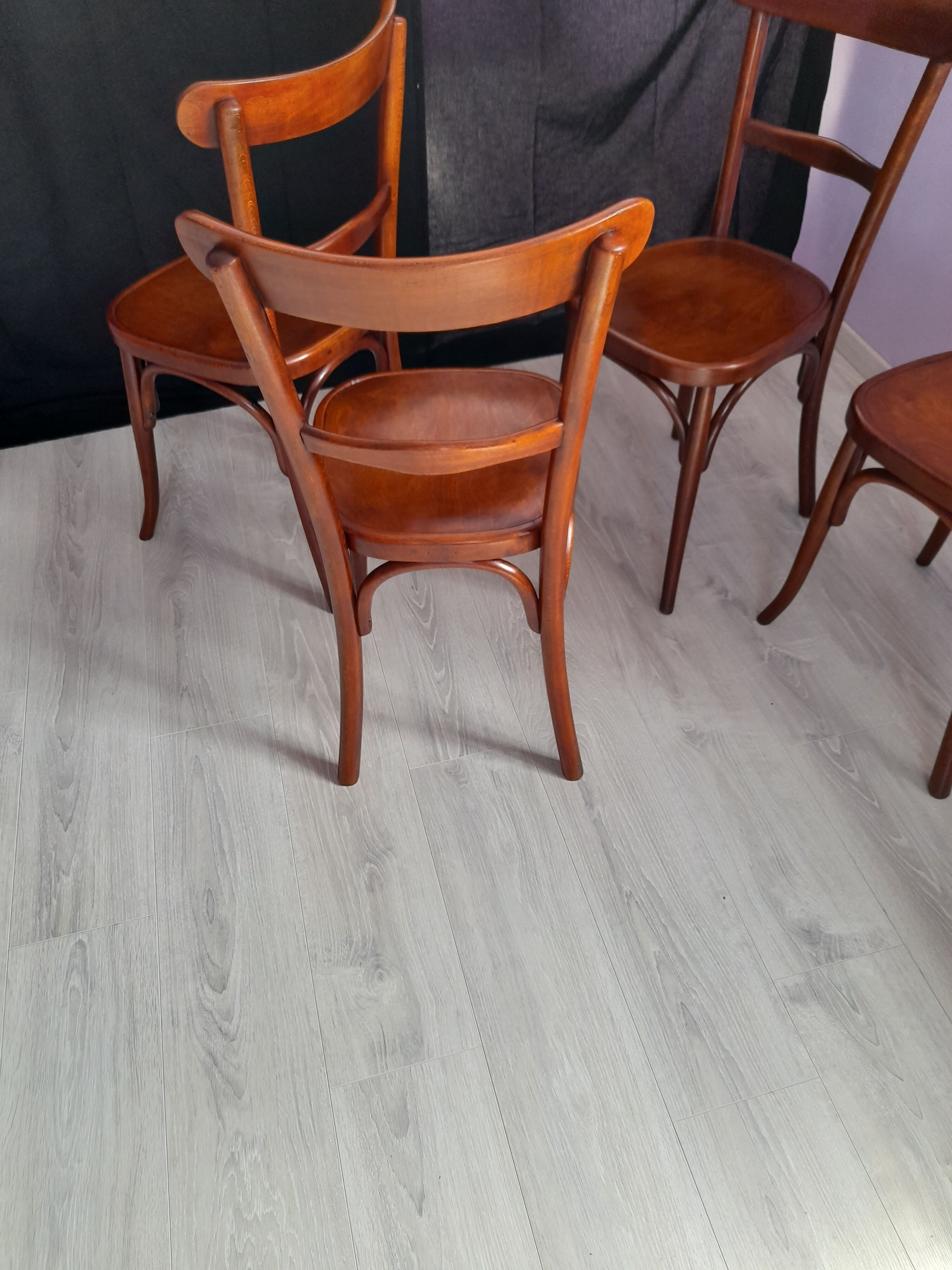 Suite of 4 bistro chairs, published by fischel