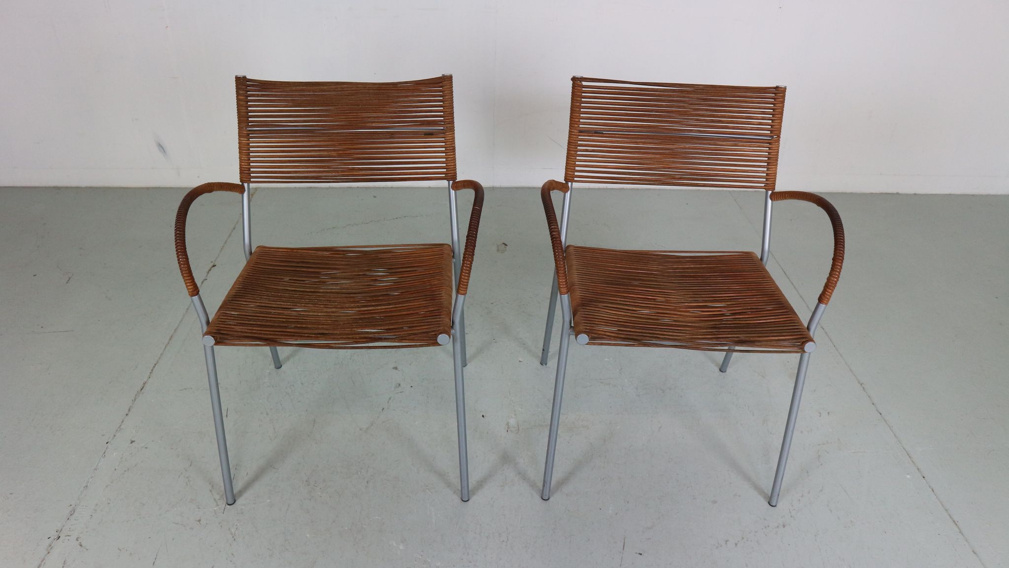 Set of 2 leather Mis B2 RVS armchairs by Tito Agnoli  for Pierantonio Bonacina