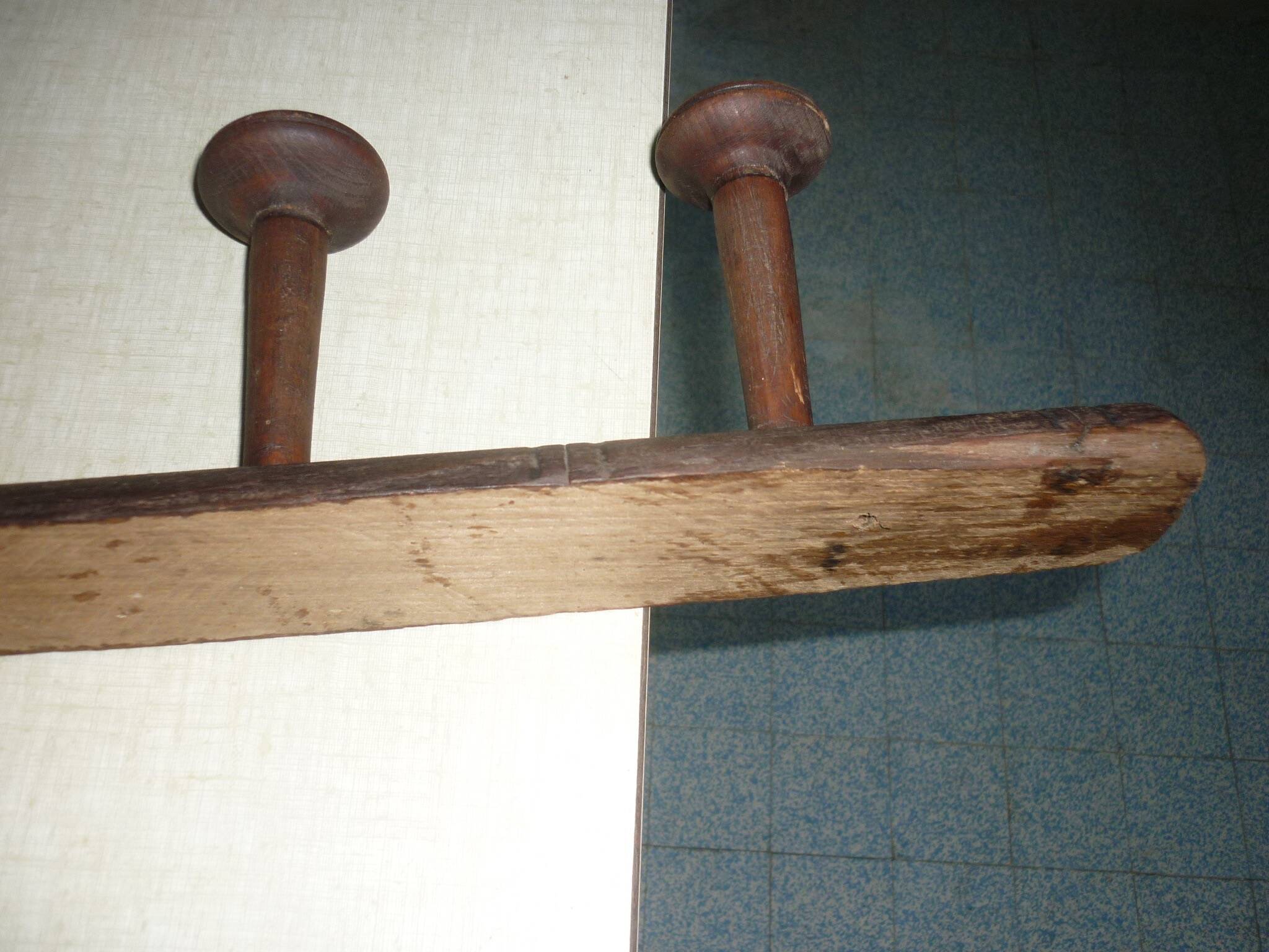 Wooden wall-mounted coat rack