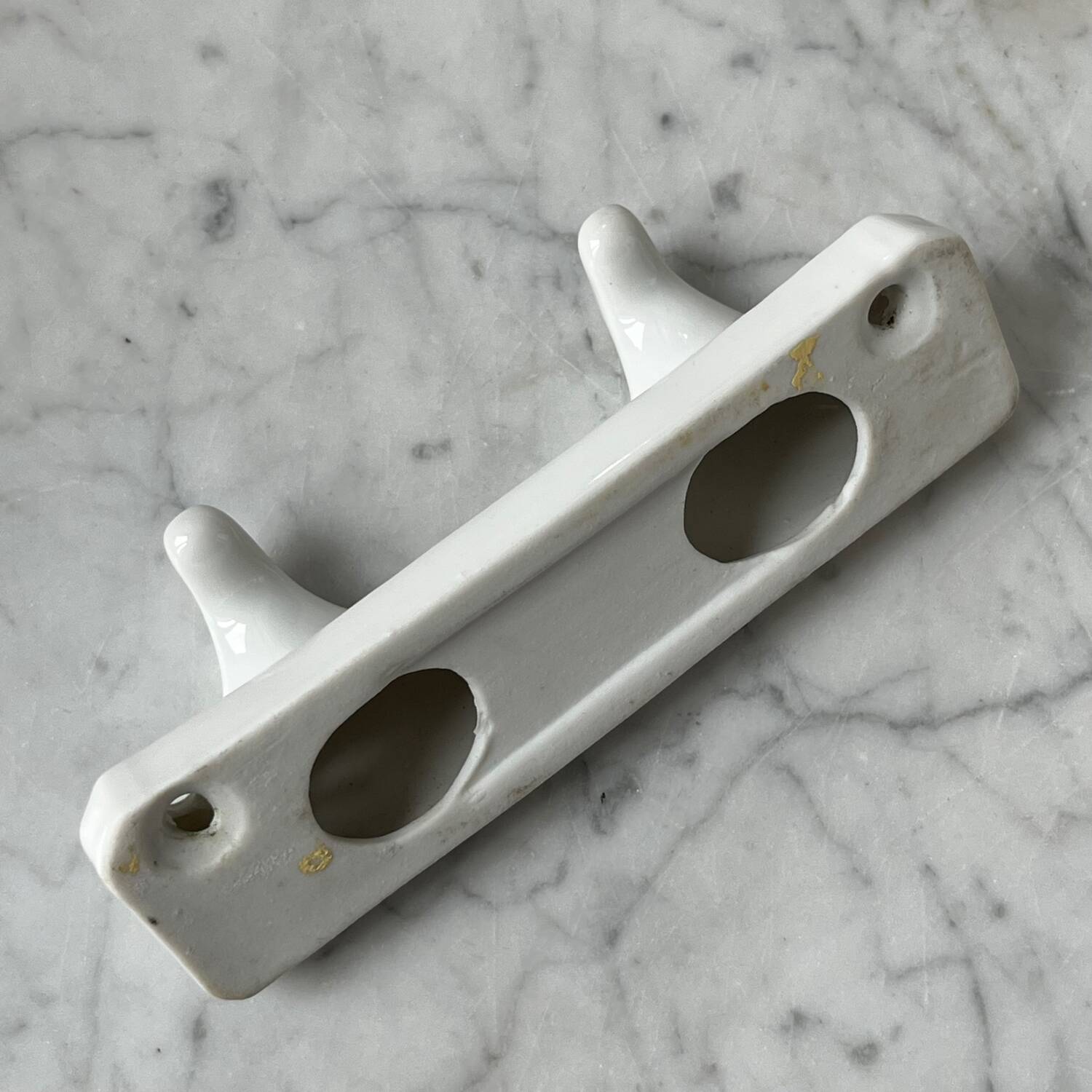 White porcelain coat hooks