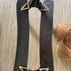 Pair of low Egyptian stools, camel saddles in wood, leather and brass
