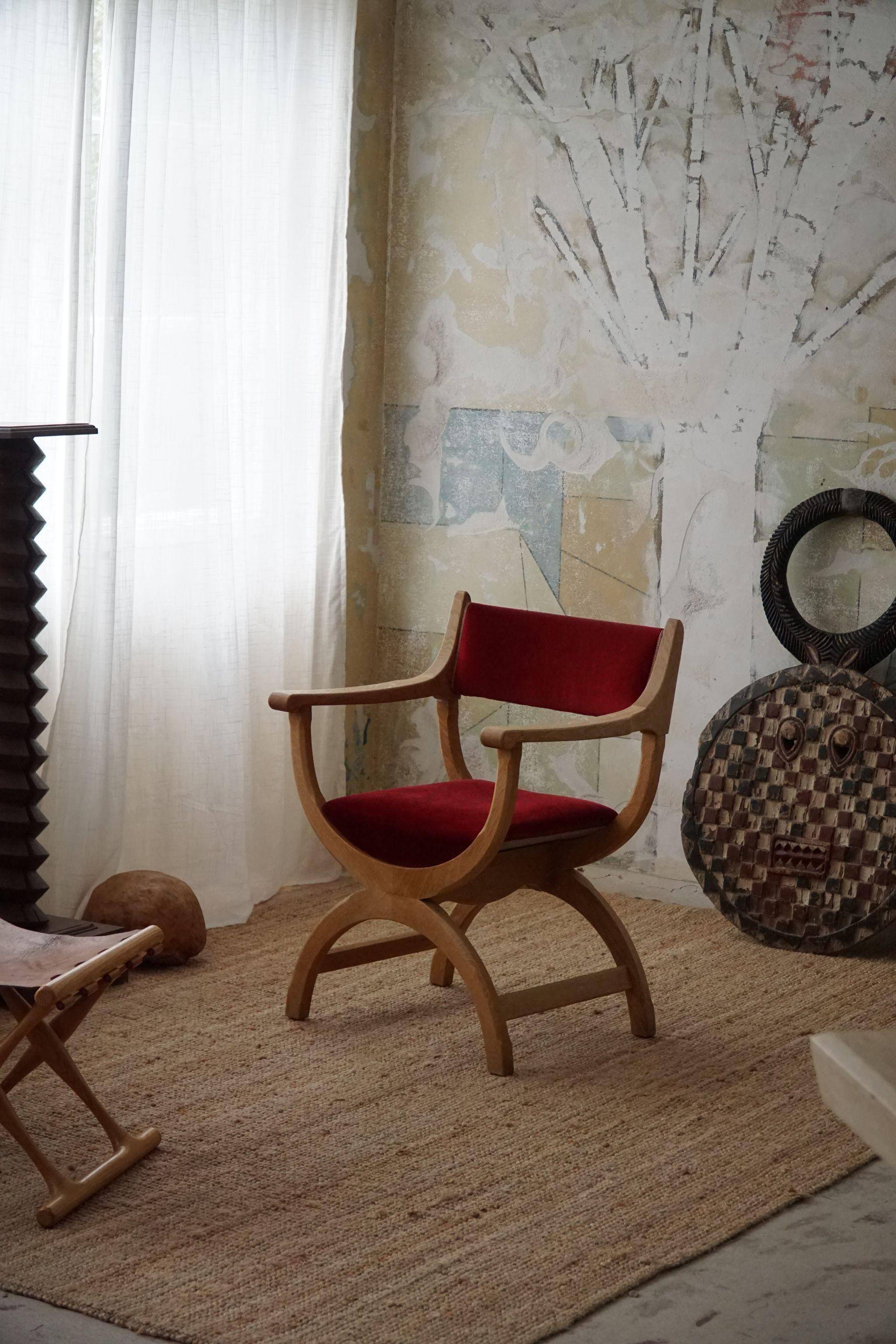 Henning Kjærnulf, armchair in oak and velvet, model "Kurul", mid-century, 1960s.