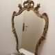 Wall mirror with gold patina ornaments