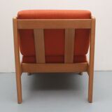 1970s chair in oak and orange cushions
