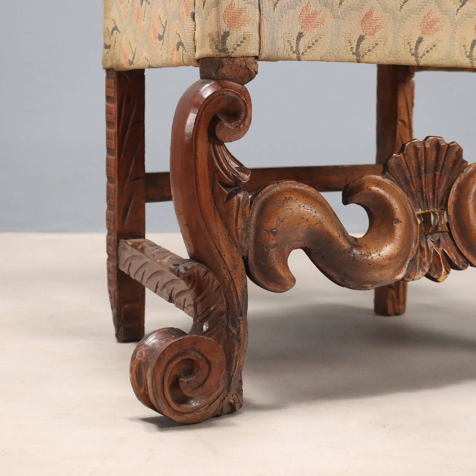 Pair of antique Baroque armchairs in walnut and fabric, Italy, 17th century.
