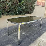 Vintage curved rectangular dining table in smoked glass and metal.