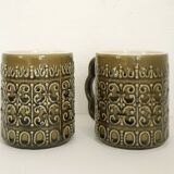 Duo of BP 70's slip mugs