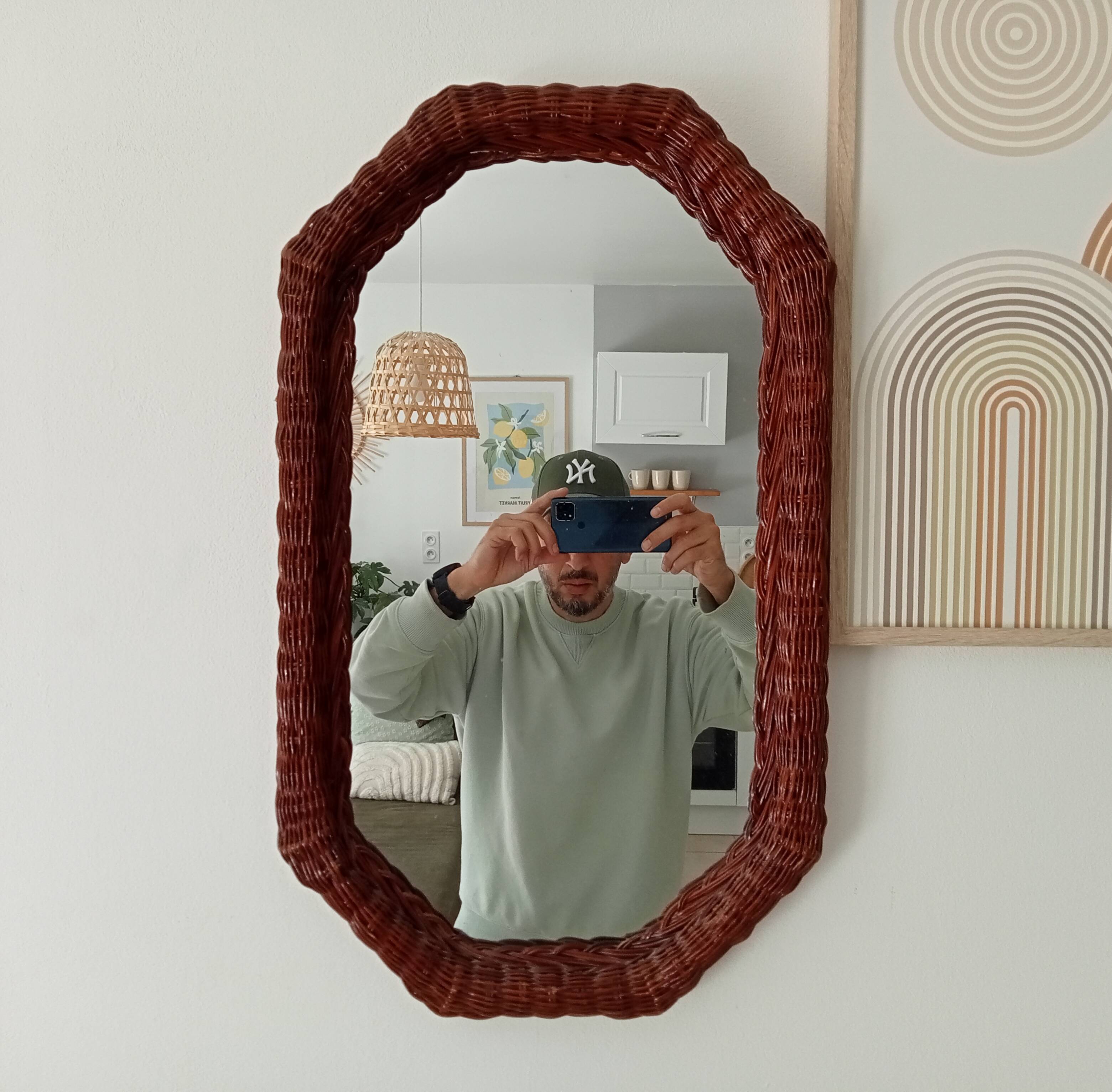 Vintage octagonal mirror in woven rattan.