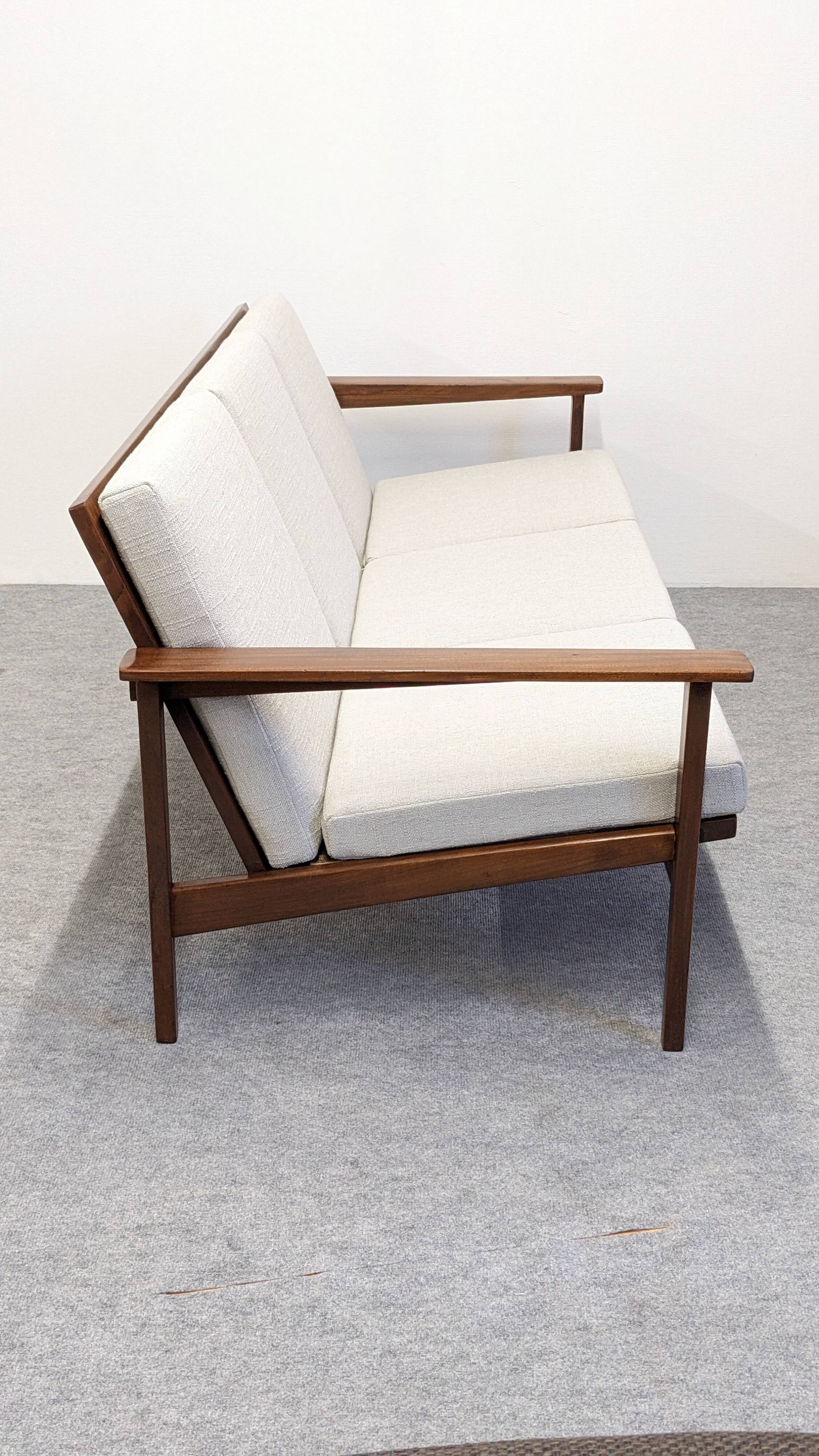 Scandinavian style three-seater sofa in teak, France circa 1950.