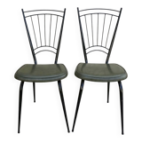 Black metal chairs with khaki faux leather seats, circa 1960.