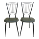 Black metal chairs with khaki faux leather seats, circa 1960.