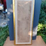 narrow gilded mirror in Louis XV style