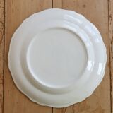 Round vintage ivory earthenware serving dish with scalloped rim.