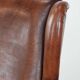Classic vintage wingback chair in sheepskin and wood