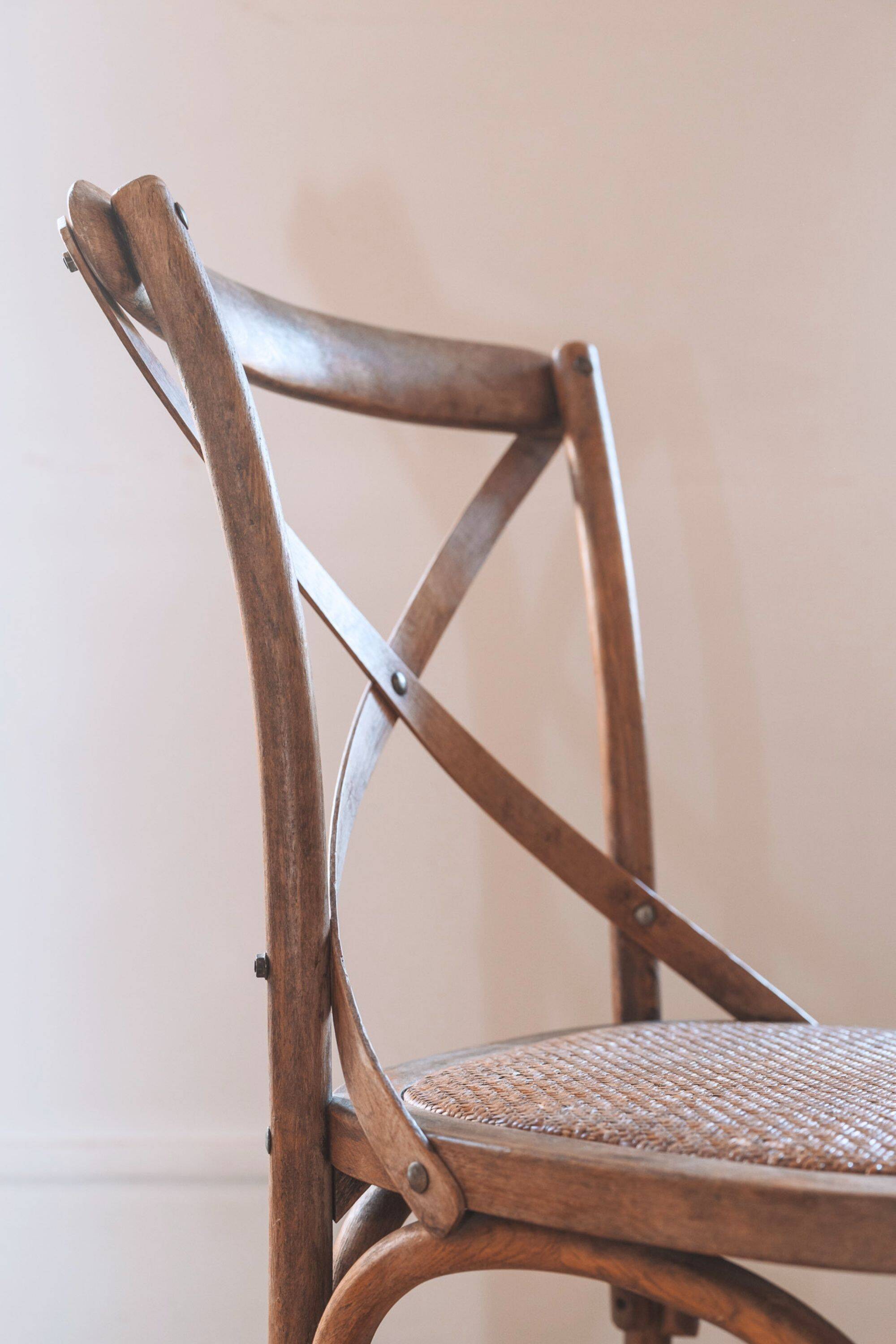 Bistro chairs with cross-back, cane seat.