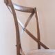Bistro chairs with cross-back, cane seat.