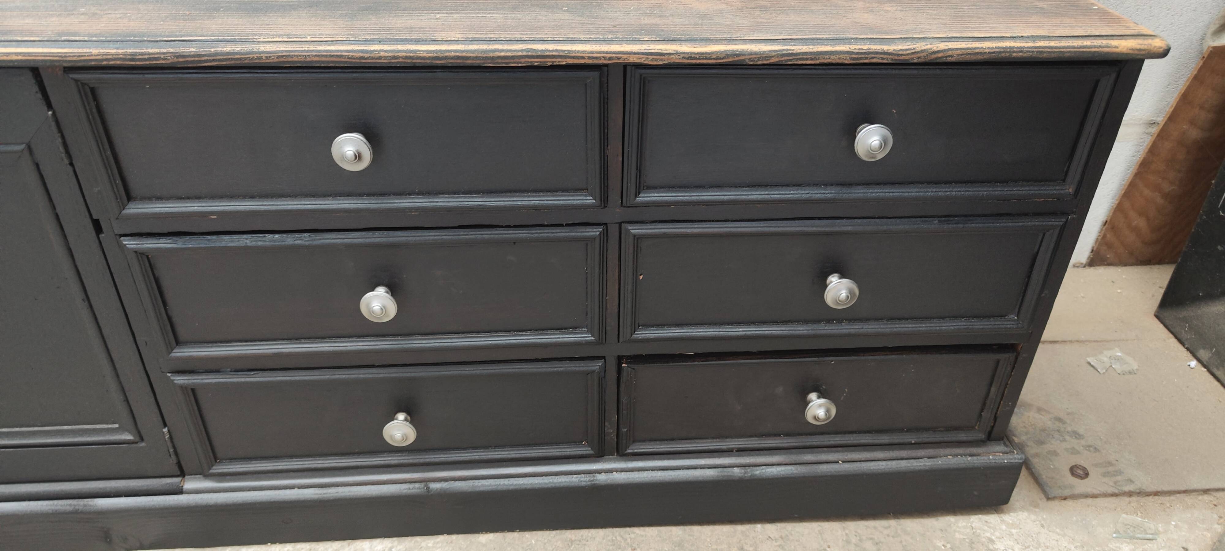 Low TV cabinet with black patina, twelve drawers and one door