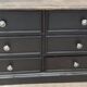 Low TV cabinet with black patina, twelve drawers and one door
